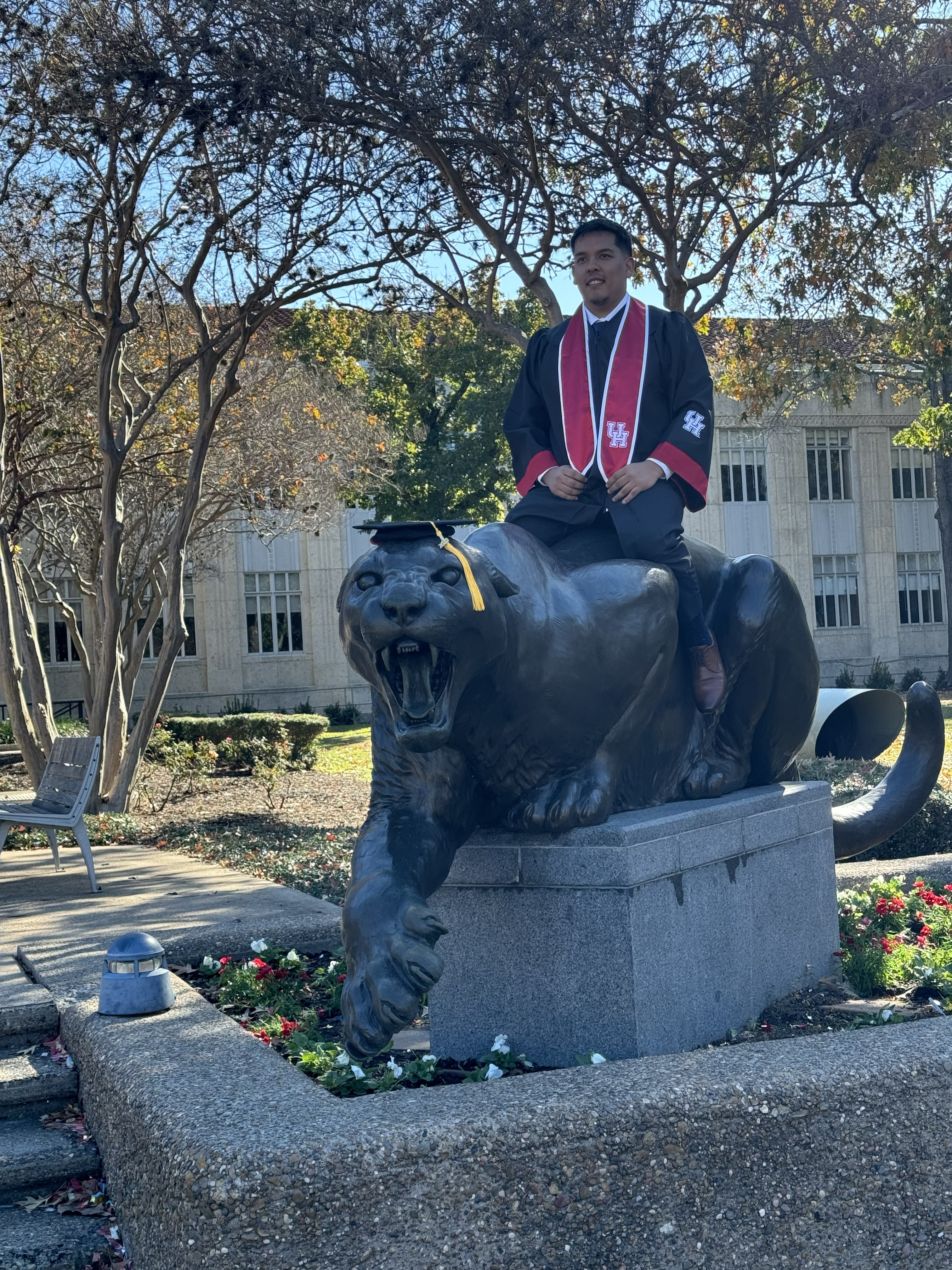 Juan Garcia Dominguez in graduation regalia at the University of Houston